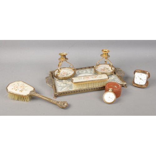 112 - A five piece Delina dressing table set, together with Stanlet travelling clock, and Ingersoll pocket... 