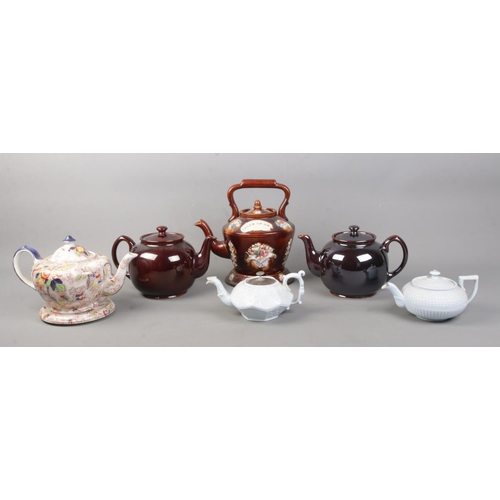 117 - Six decorative teapots, to include Bargeware with stand and motto 'Think of Me' and two Sadler 'Brow... 