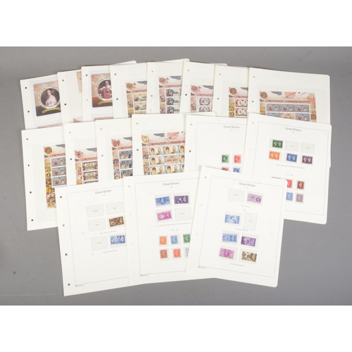 123 - A collection of Coronation commemorative stamp sheets and first day covers to include Ascension Isla... 