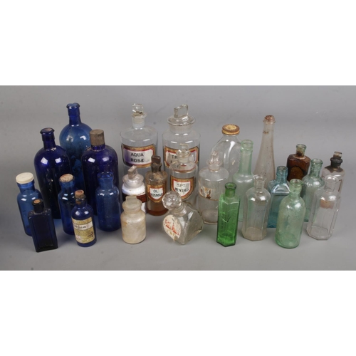 135 - A collection of late 19th/early 20th century apothecary and chemist bottles.