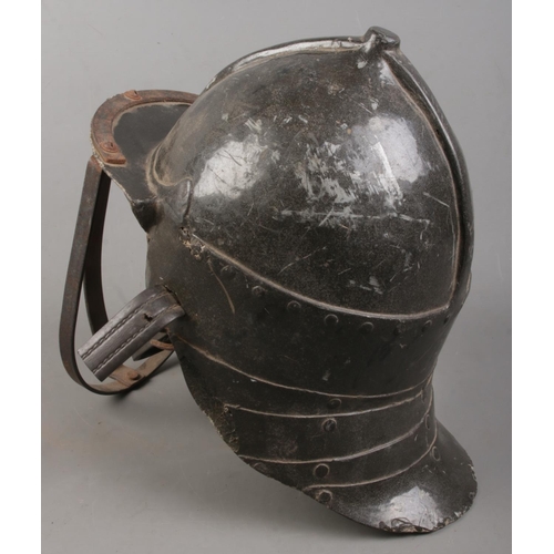 140 - A reproduction Zischagge 'Lobster Tailed' pot helmet.