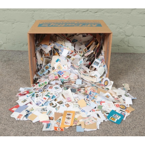 169 - A box containing a good collection of loose Great British and world stamps. Approximately 4kg.