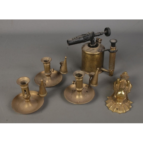 176 - A small collection of brass to include decorative door knocker, Sievert blow torch and three chamber... 