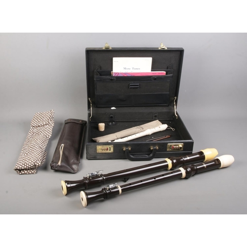 70 - Two large Aulos recorders, together with a Yamaha Soprano Recorder in sleeve; all in hinged briefcas... 