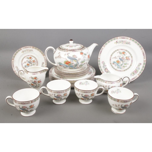 88 - A Wedgwood Kutani Crane part tea set comprising of tea pot, cups, side plate, sandwich plates and tw... 