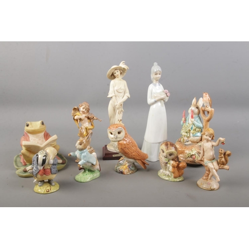 90 - A collection of figurines including Beswick owl, Royal Albert 