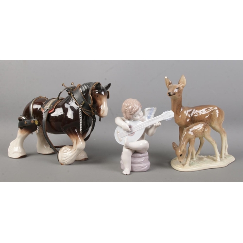 91 - Three ceramic figure groups, to include Shire horse, Lladro cherub playing the loot and Beswick styl... 