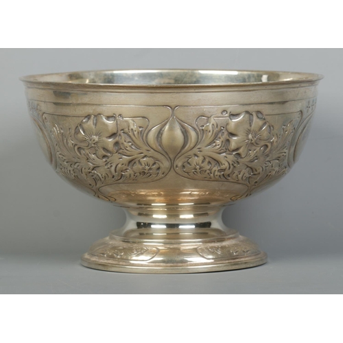 106 - A George V silver punch bowl with embossed decoration. Assayed Sheffield 1928 by John & William F De... 