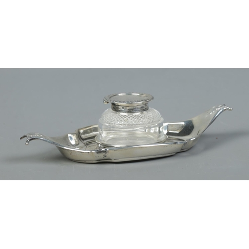 111 - A Victorian silver and glass inkwell on boat shaped stand. Assayed Birmingham 1892 by Samuel Walton ... 