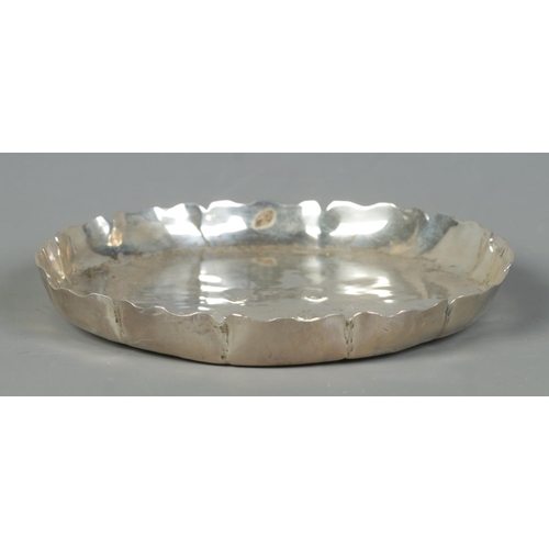 116 - A heavy silver shallow dish with scalloped edge. Assayed London 1988 by Dorothy May Budd. Diameter 1... 