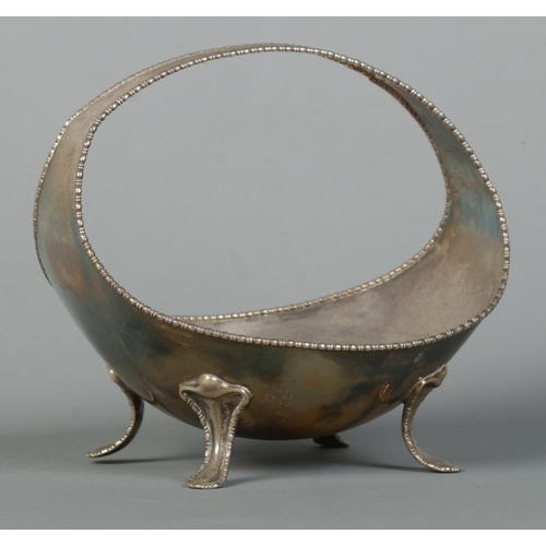 118 - A George V silver basket raised on four scrolled feet. Assayed Sheffield 1912 by Atkin Brothers. Hei... 