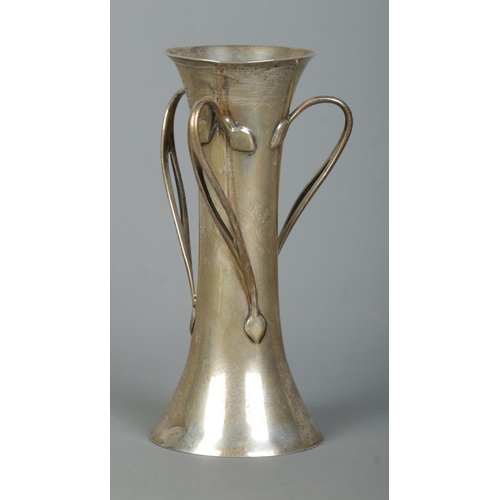 119 - An Art Nouveau silver vase. Having three bifuracted twisting handles. Assayed London 1901 by Charles... 