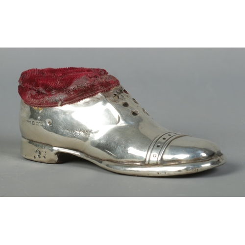 121 - A George V silver pin cushion formed as a shoe. Assayed Birmingham 1920 by S Blanckensee & Son Ltd. ... 