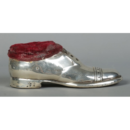 121 - A George V silver pin cushion formed as a shoe. Assayed Birmingham 1920 by S Blanckensee & Son Ltd. ... 