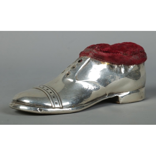 121 - A George V silver pin cushion formed as a shoe. Assayed Birmingham 1920 by S Blanckensee & Son Ltd. ... 