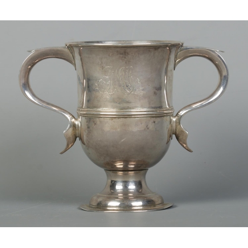 127 - A George III silver twin handled cup. Engraved with a windmill to one side and monogram to other. As... 