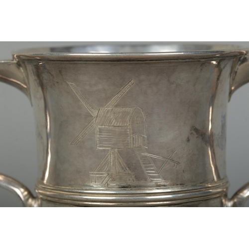 127 - A George III silver twin handled cup. Engraved with a windmill to one side and monogram to other. As... 