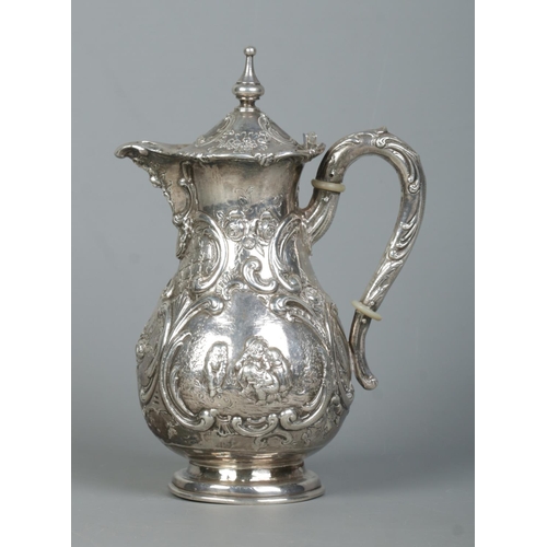 132 - An early 20th century hot water pot. Having repousse scrolling decoration and scenes depicting child... 