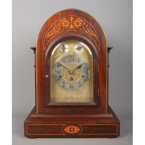 137 - A Junghans inlaid mahogany bracket clock. Having brass dial and subsidiary dials for speed and chime... 