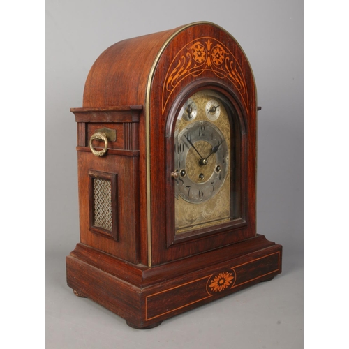 137 - A Junghans inlaid mahogany bracket clock. Having brass dial and subsidiary dials for speed and chime... 