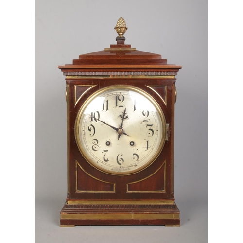 138 - A Winterhalder & Hofmeier mahogany bracket clock. Having acorn finial, twin brass loop handles, silv... 