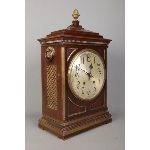 138 - A Winterhalder & Hofmeier mahogany bracket clock. Having acorn finial, twin brass loop handles, silv... 