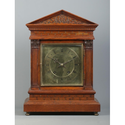 140 - A Winterhalder & Hofmeier carved oak bracket clock. Having square brass dial and Roman numeral marke... 