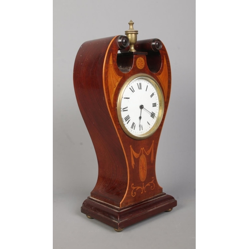 141 - An Edwardian inlaid mahogany twin swan neck mantel clock. Having Roman numeral markers and French mo... 