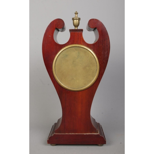 141 - An Edwardian inlaid mahogany twin swan neck mantel clock. Having Roman numeral markers and French mo... 