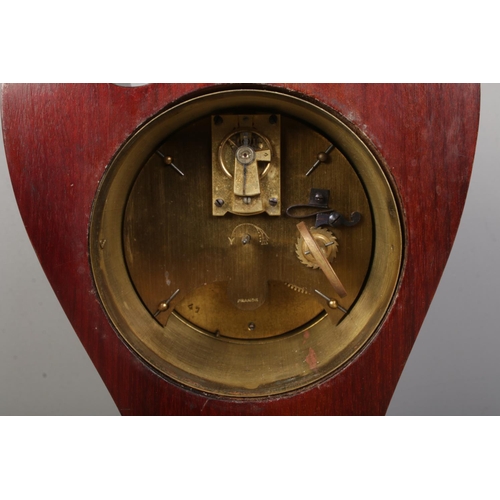 141 - An Edwardian inlaid mahogany twin swan neck mantel clock. Having Roman numeral markers and French mo... 