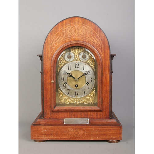 142 - A Junghans inlaid mahogany bracket clock. Having brass dial and subsidiary dials for speed and chime... 