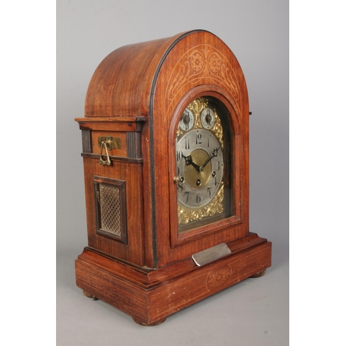 142 - A Junghans inlaid mahogany bracket clock. Having brass dial and subsidiary dials for speed and chime... 