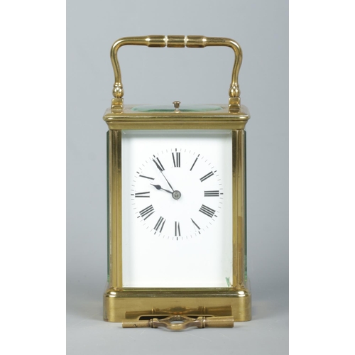 146 - An early 20th century brass and glass repeater carriage clock. Having swing handle, Roman numeral ma... 