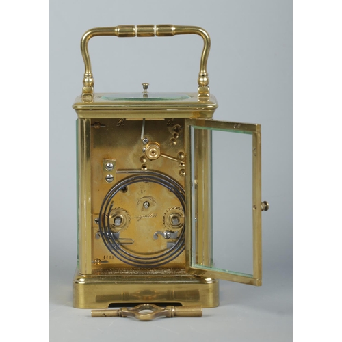 146 - An early 20th century brass and glass repeater carriage clock. Having swing handle, Roman numeral ma... 