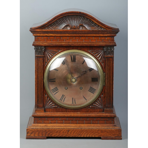 147 - A carved oak cased Winterhalder & Hofmeier bracket clock. Having Roman numeral markers and chiming o... 