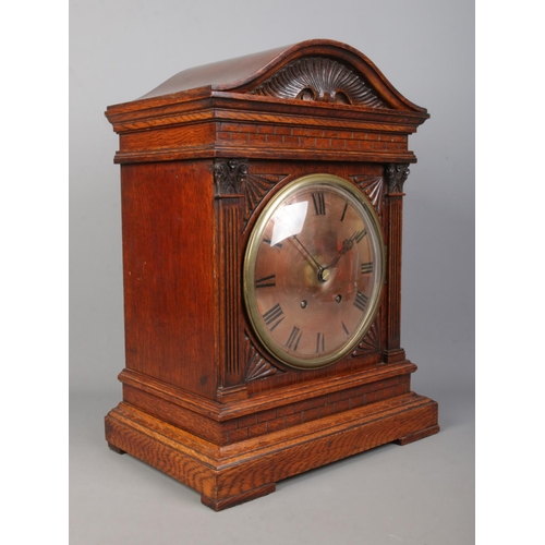 147 - A carved oak cased Winterhalder & Hofmeier bracket clock. Having Roman numeral markers and chiming o... 