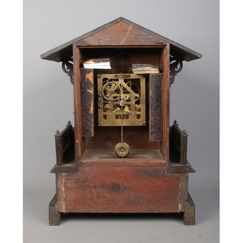 148 - A late 19th/early 20th century Black Forest cuckoo mantel clock. Housing twin train movement and chi... 