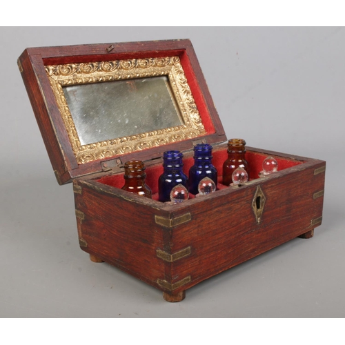 151 - An early 20th century Anglo Indian brass bound box with wire work inlaid decoration. Having fitted i... 