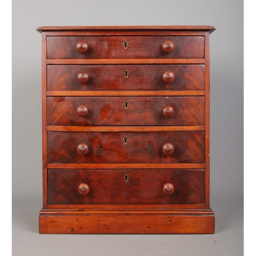 158 - A miniature mahogany five drawer chest in the Georgian style. Height 40cm, Width 34cm, Depth 21cm.