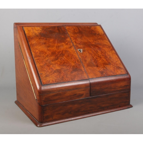 159 - A Victorian walnut and mahogany desk tidy with fitted interior and perpetual calendar. Height 33cm, ... 