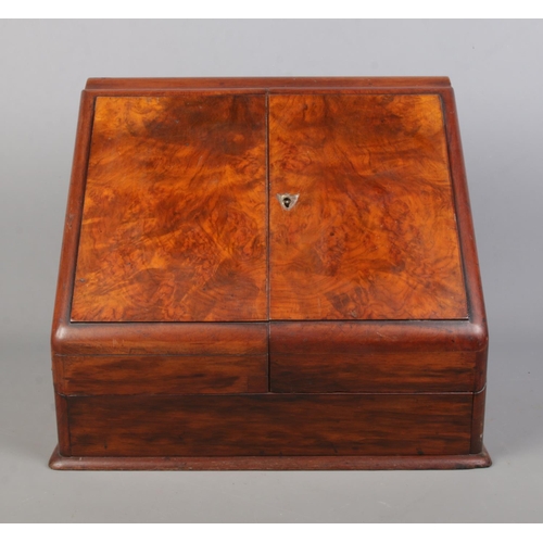 159 - A Victorian walnut and mahogany desk tidy with fitted interior and perpetual calendar. Height 33cm, ... 