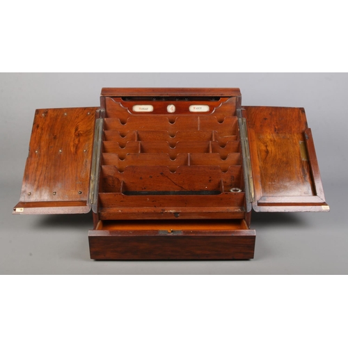 159 - A Victorian walnut and mahogany desk tidy with fitted interior and perpetual calendar. Height 33cm, ... 