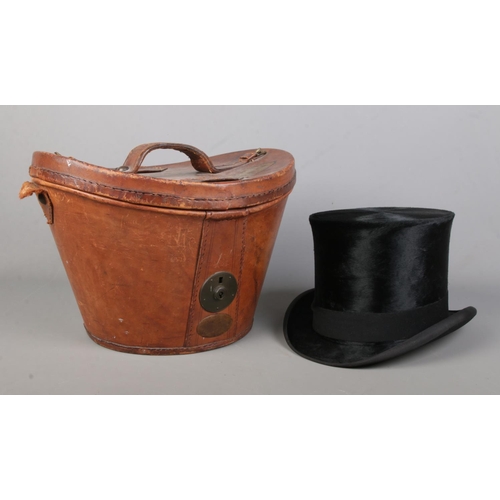 162 - A Victorian Tress & Co silk top hat in fitted leather box. Front to back 20cm, side to side 16cm. Ci... 