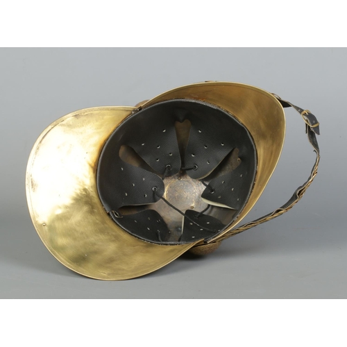 163 - A brass Merryweather fire helmet for the Metropolitan Fire Brigade.