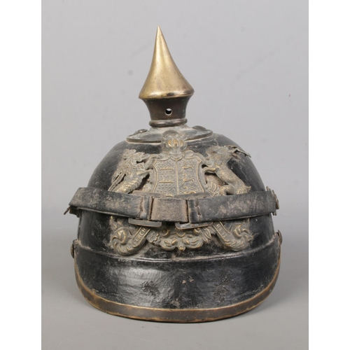 166 - An Imperial German Wurttemberg pickelhaube. Bearing coat of arms and motto Furchtlos Und Trew.