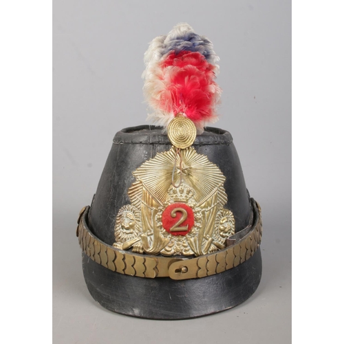 169 - A Prussian leather jager shako bearing coat of arms.