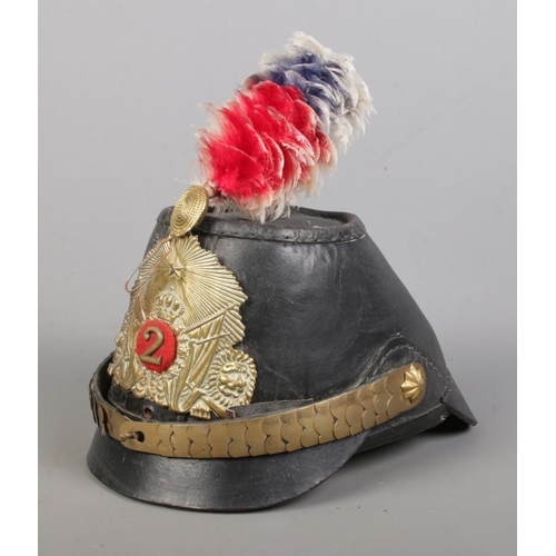 169 - A Prussian leather jager shako bearing coat of arms.