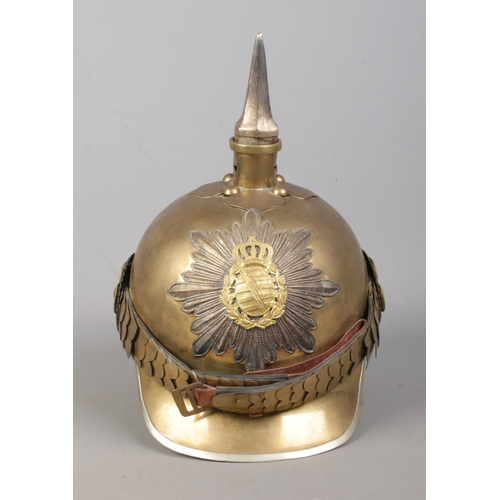 170 - A World War One pickelhaube bearing Saxon coat of arms.