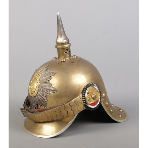 170 - A World War One pickelhaube bearing Saxon coat of arms.