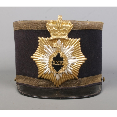 171 - A Victorian military style shako. The inside stamped for William Mutrie & Son.